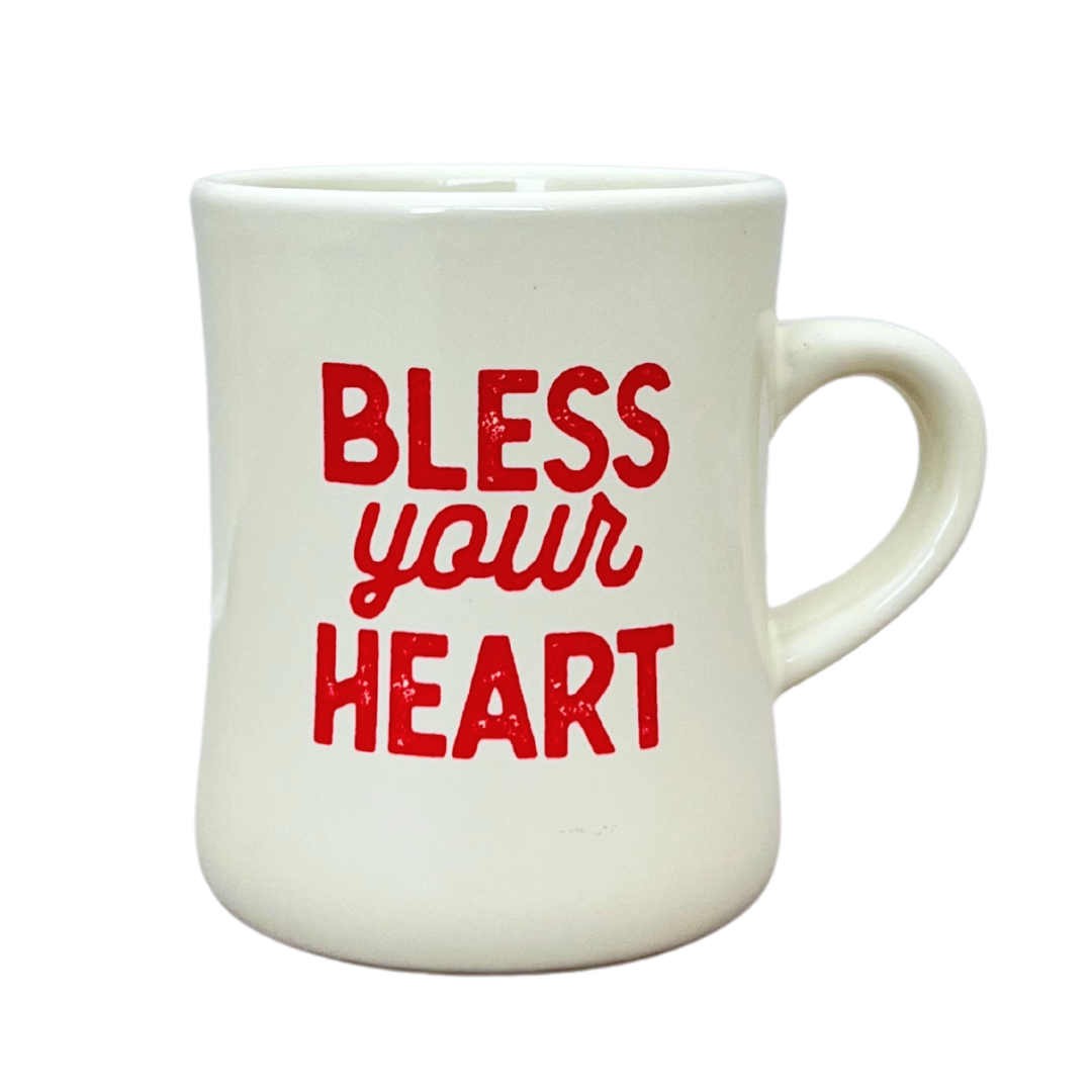 Thick walled ceramic diner mug with "bless your heart" in dark pink. 