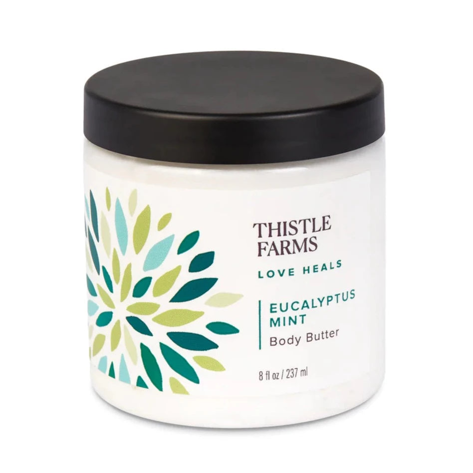 6 oz Thistle Farms Body Butter in Eucalyptus Mint, comes in plastic jar with lid. 