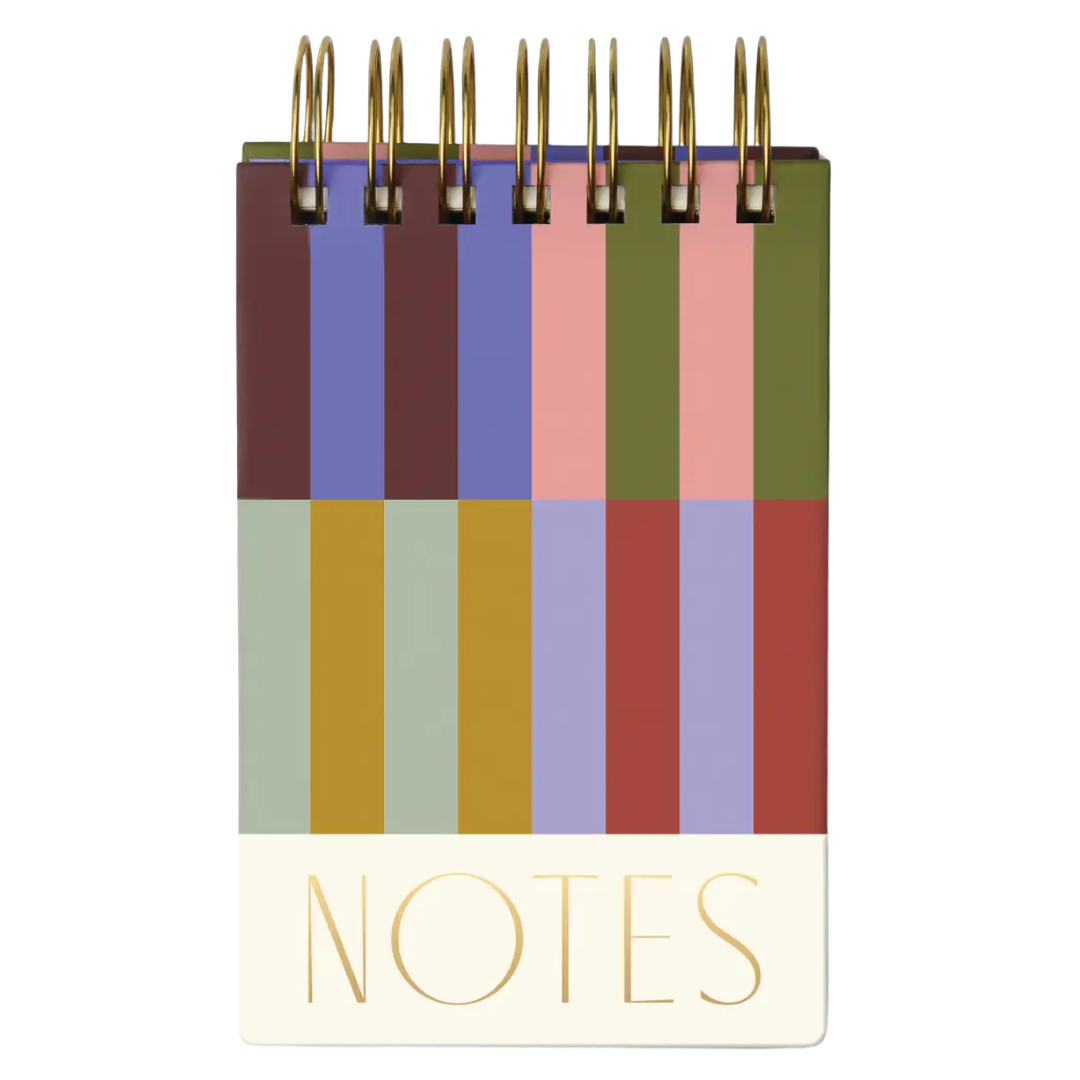"Notes" in gold foil, on multicolored striped notepad. 
