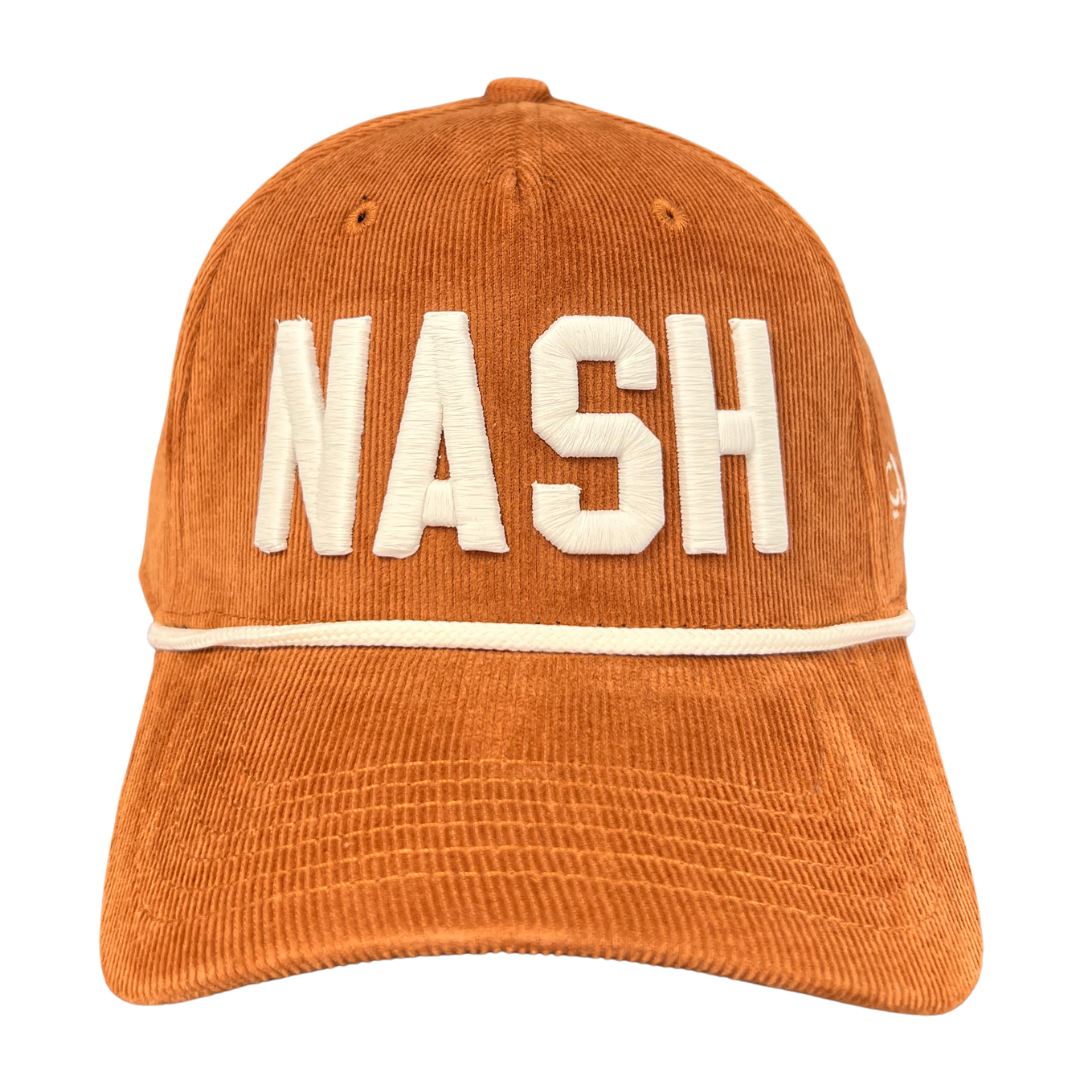 Caramel Corduroy hat with NASH embroidered in cream. 