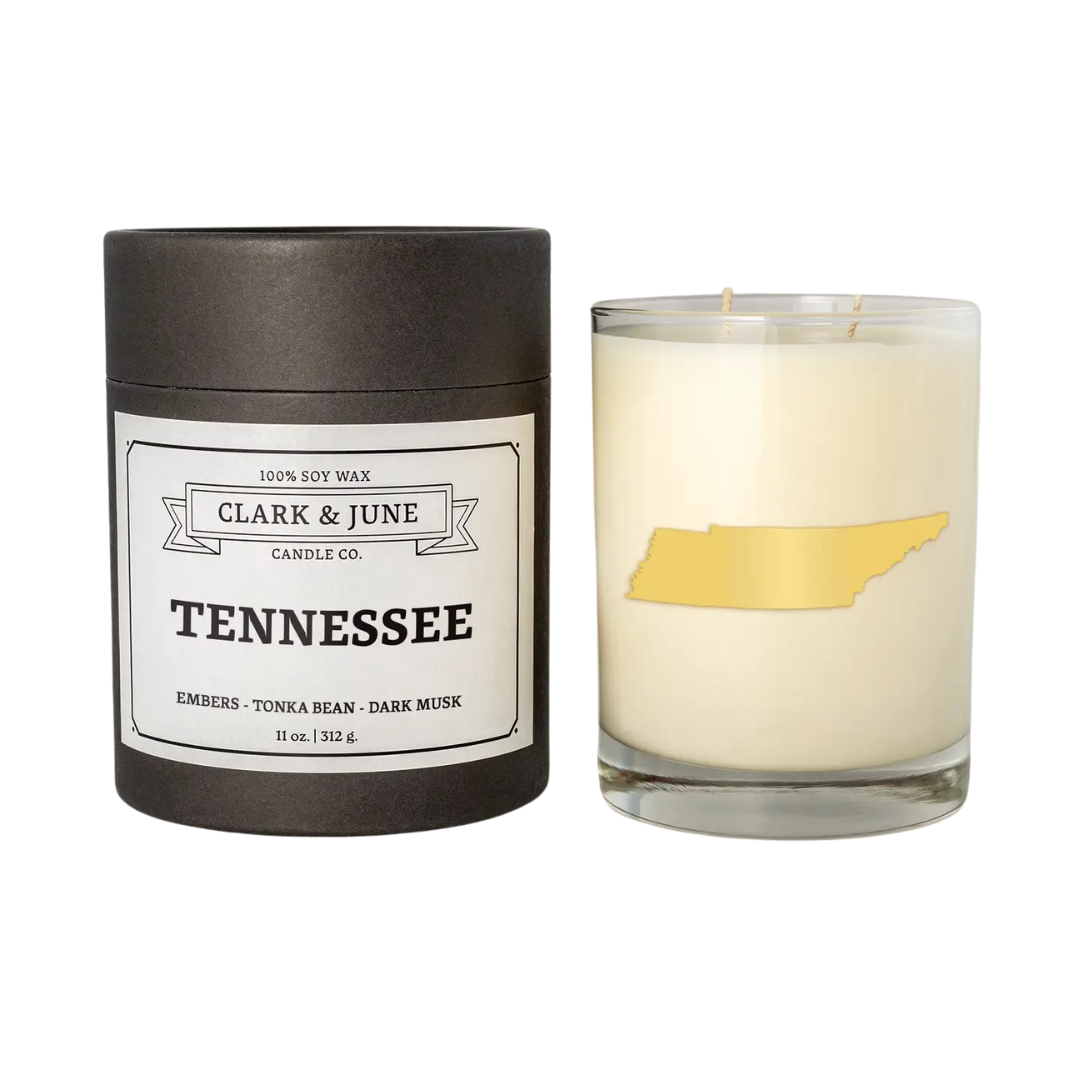 "Tennessee candle", scent embers, tonka bean, and dark musk. in an 11oz glass with gift box, tennessee state embossed in gold. 