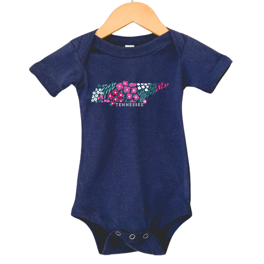 Navy baby onesie with Tennessee state made with flowers. 