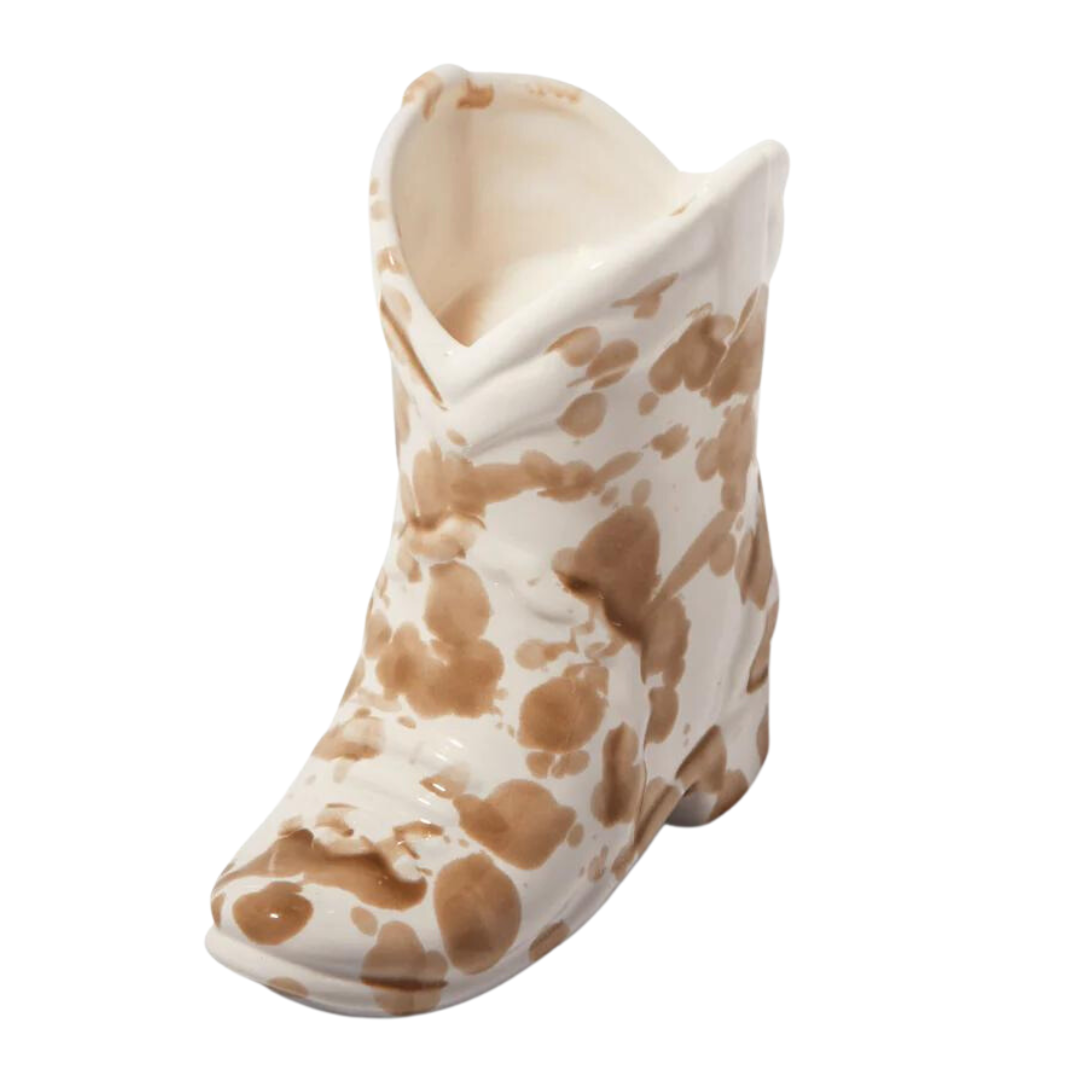 6 oz Brown and white cowgirl candle in a ceramic boot.