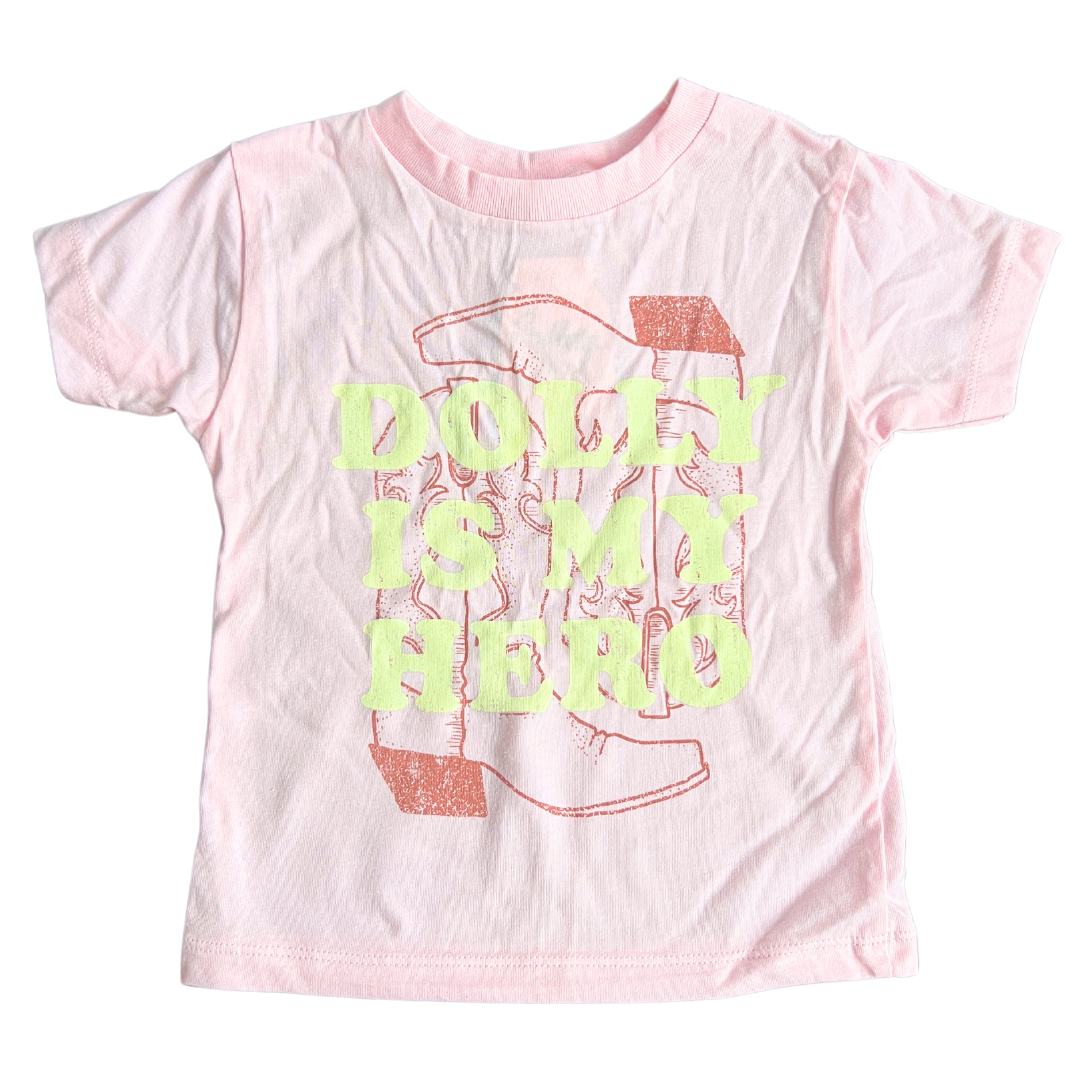 Pink shirt says, "Dolly is my Hero" screen-printed in cream with dark pink boots.