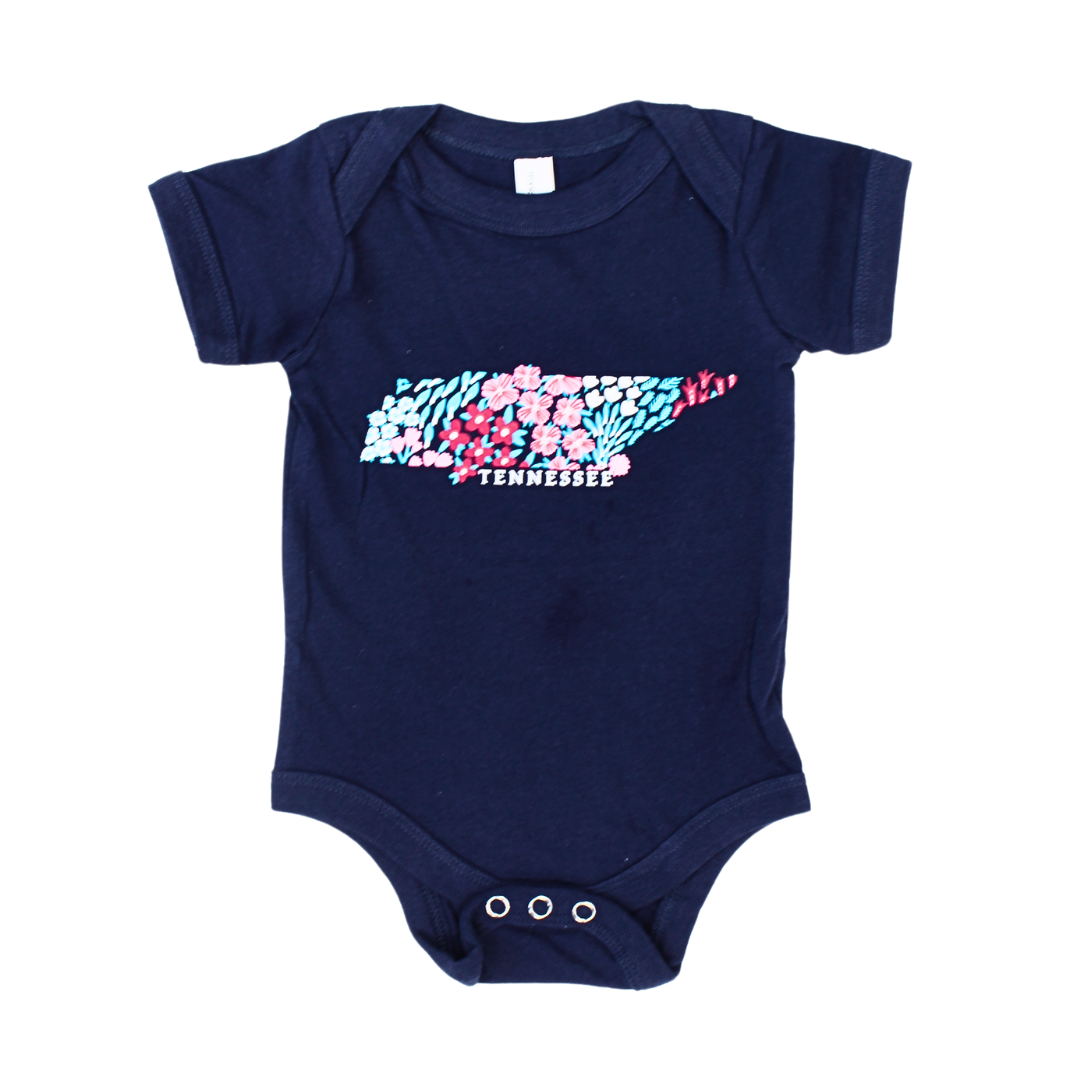 Navy baby onesie with Tennessee state made with flowers. 