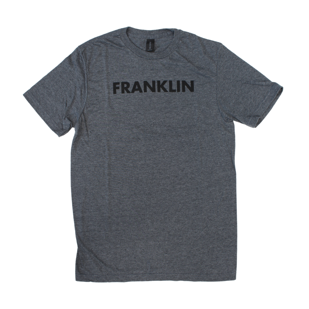 Dark grey shirt with Franklin printed in block letters. 