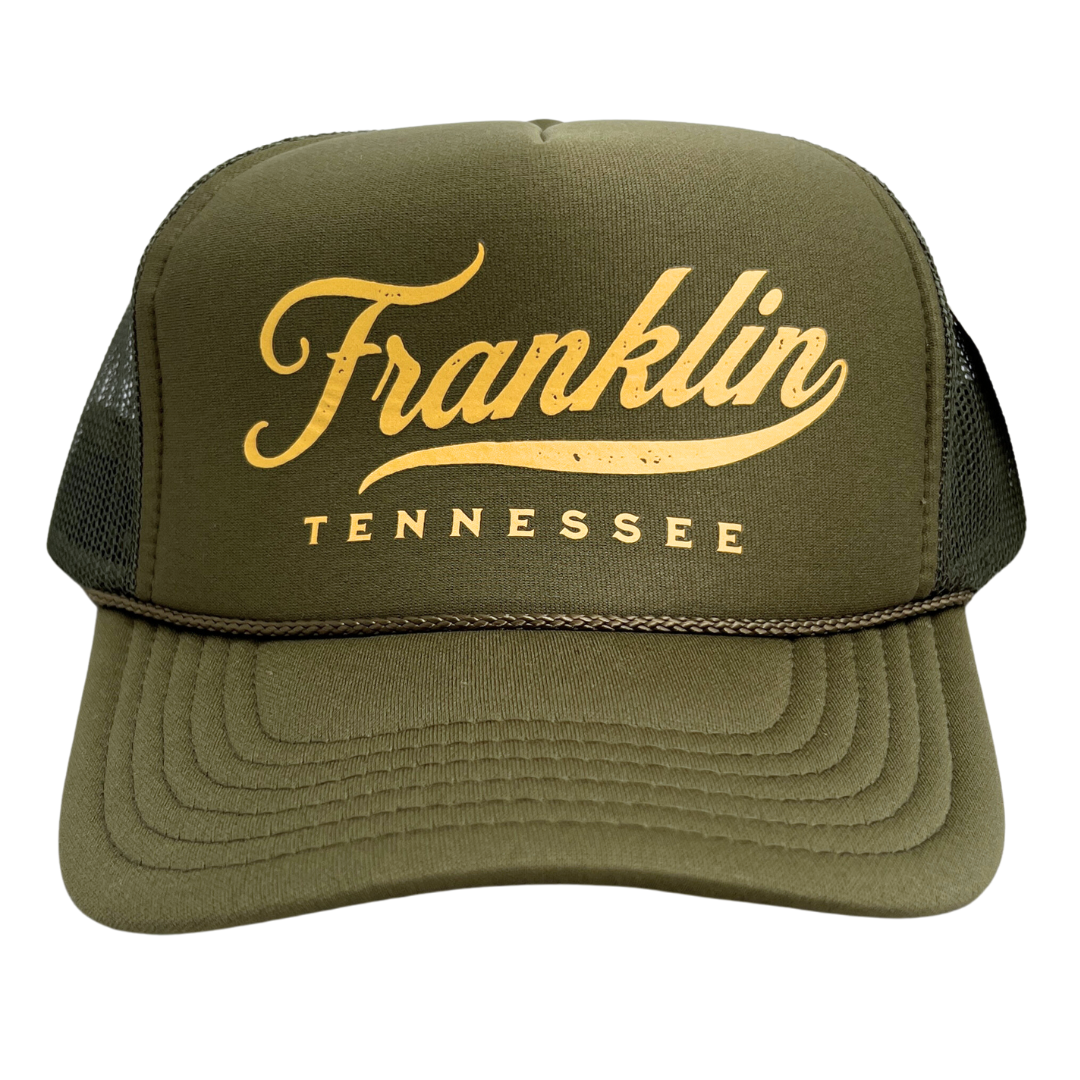 Army green trucker hat with foamy front and mesh sides' says, "Franklin Tennessee" in gold.