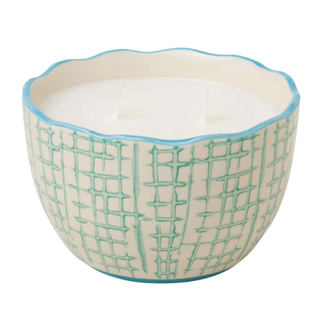 Fresh cut basil candle in blue and white ceramic dish. 