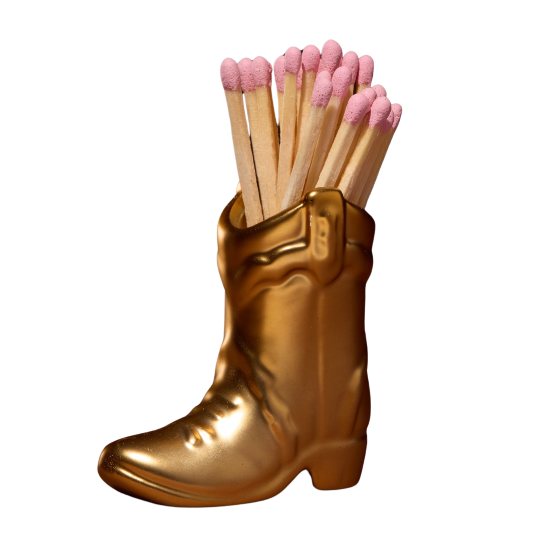 25 safety matches in gold ceramic cowboy boot matchstick holder.