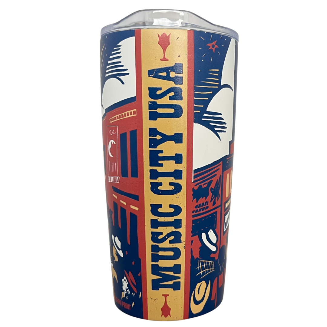 Tumbler mug that says "Music City USA" along with some artful and colorful drawings of downtown Nashville.