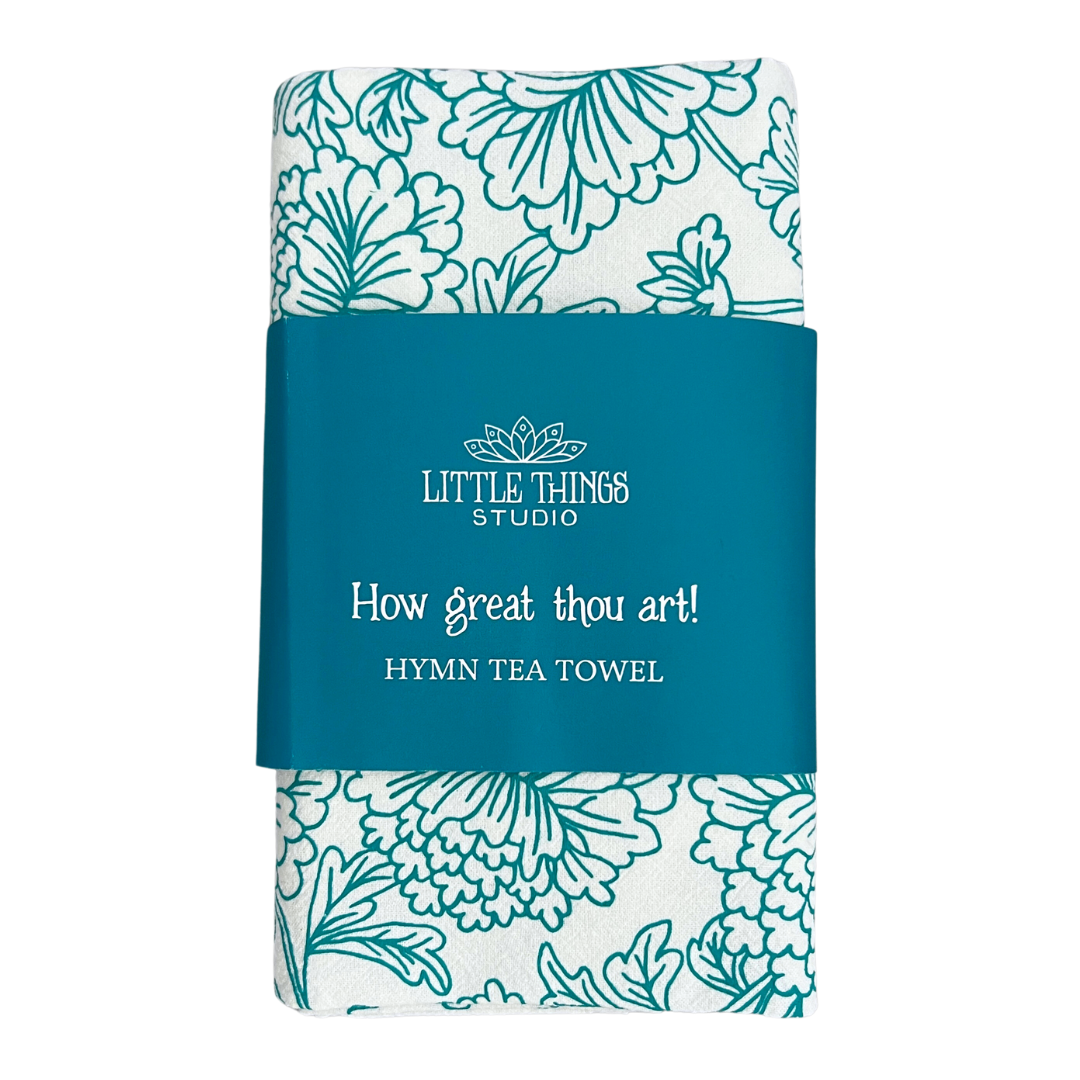 cotton kitchen towel floral design and hymn lyrics.