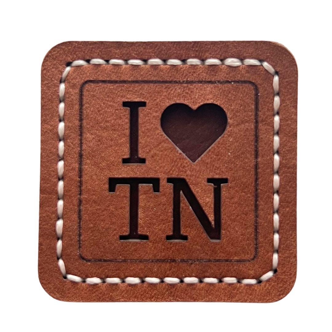 approximately 3 inch round leather magnet.  