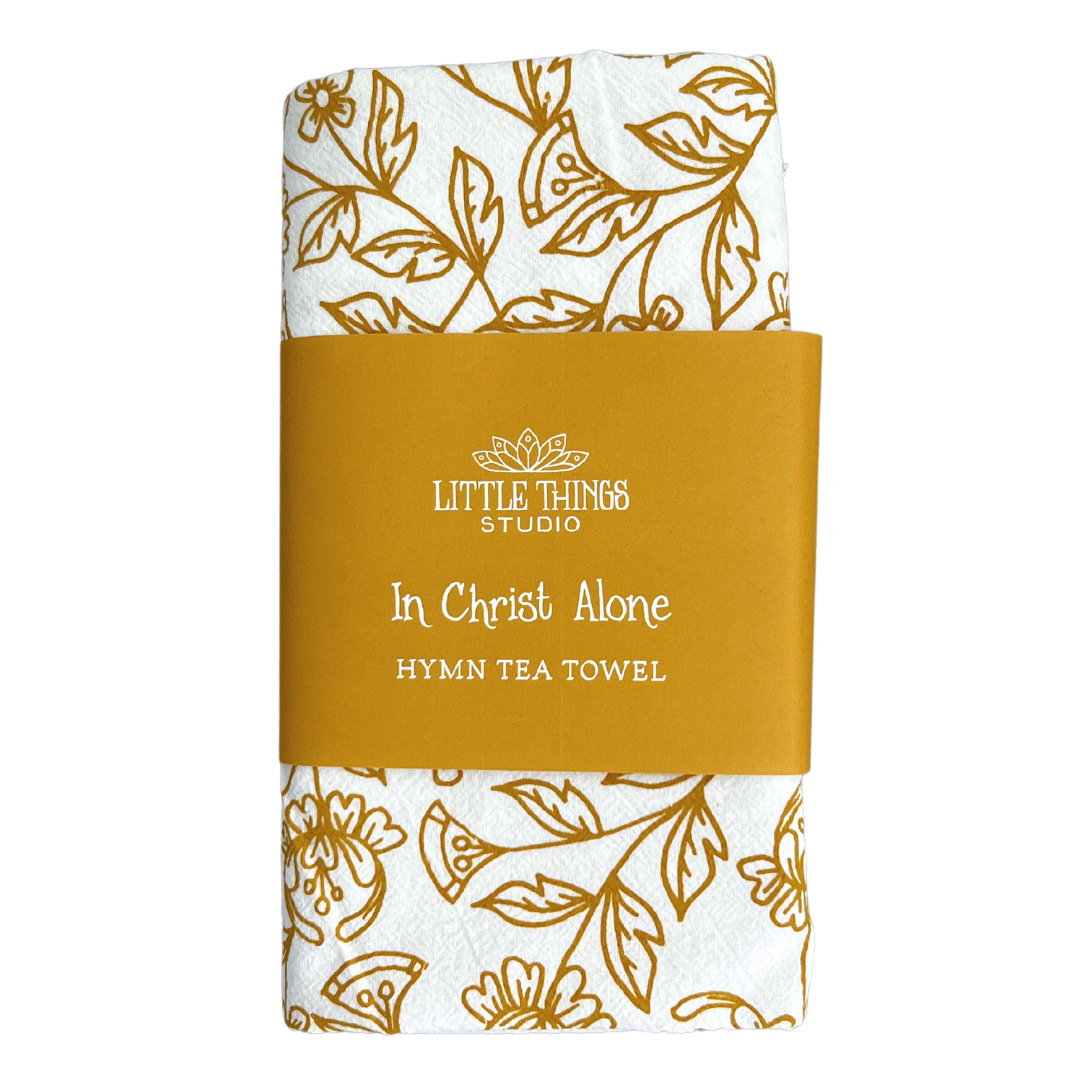 cotton kitchen towel floral design and hymn lyrics.
