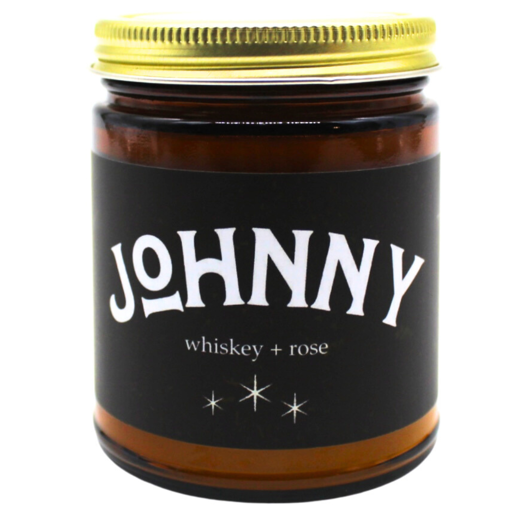 "Johnny" candle Scents of whiskey and rose, amber glass jar with lid. 