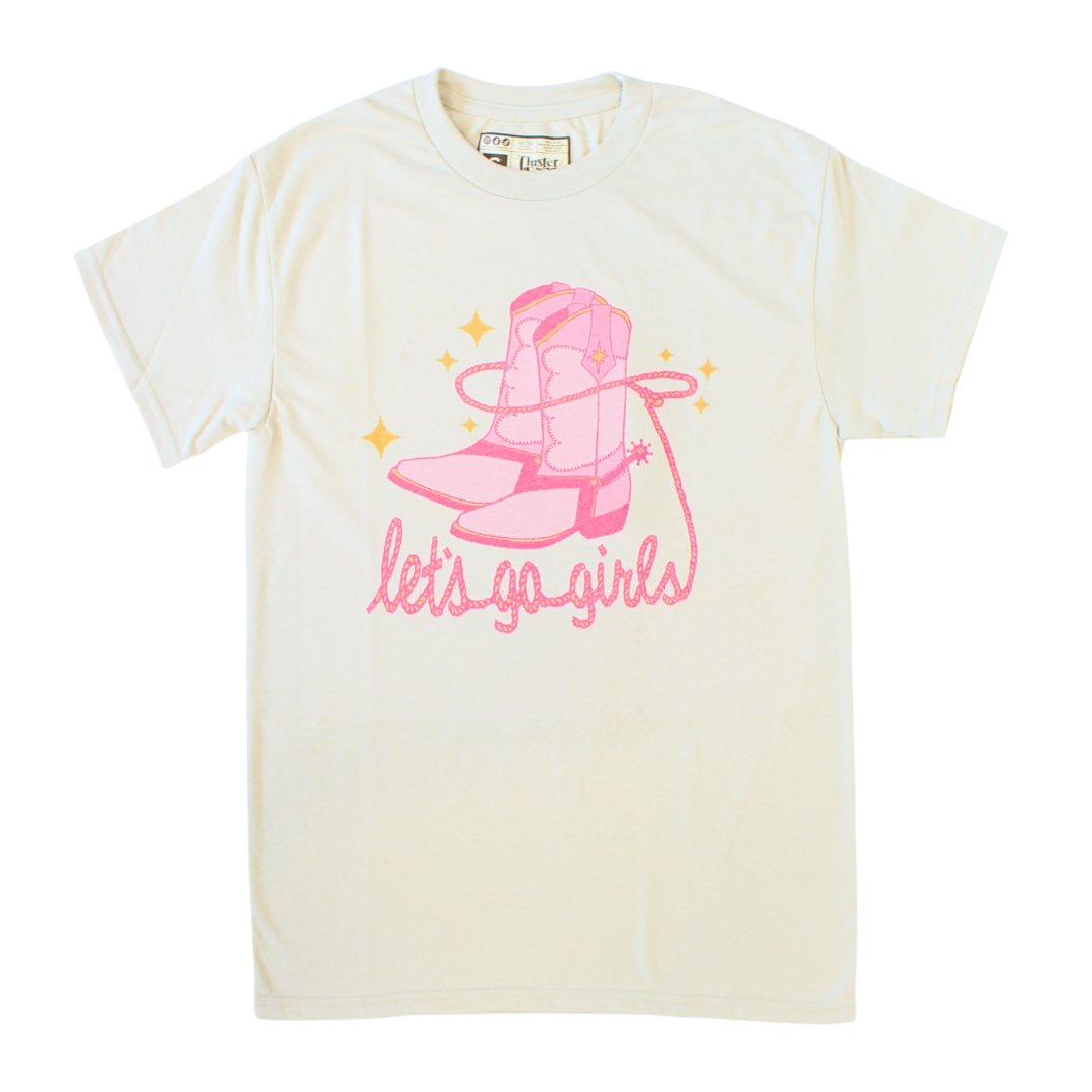 "Let's Go Girls" with boots and lasso in pink, tan shirt.