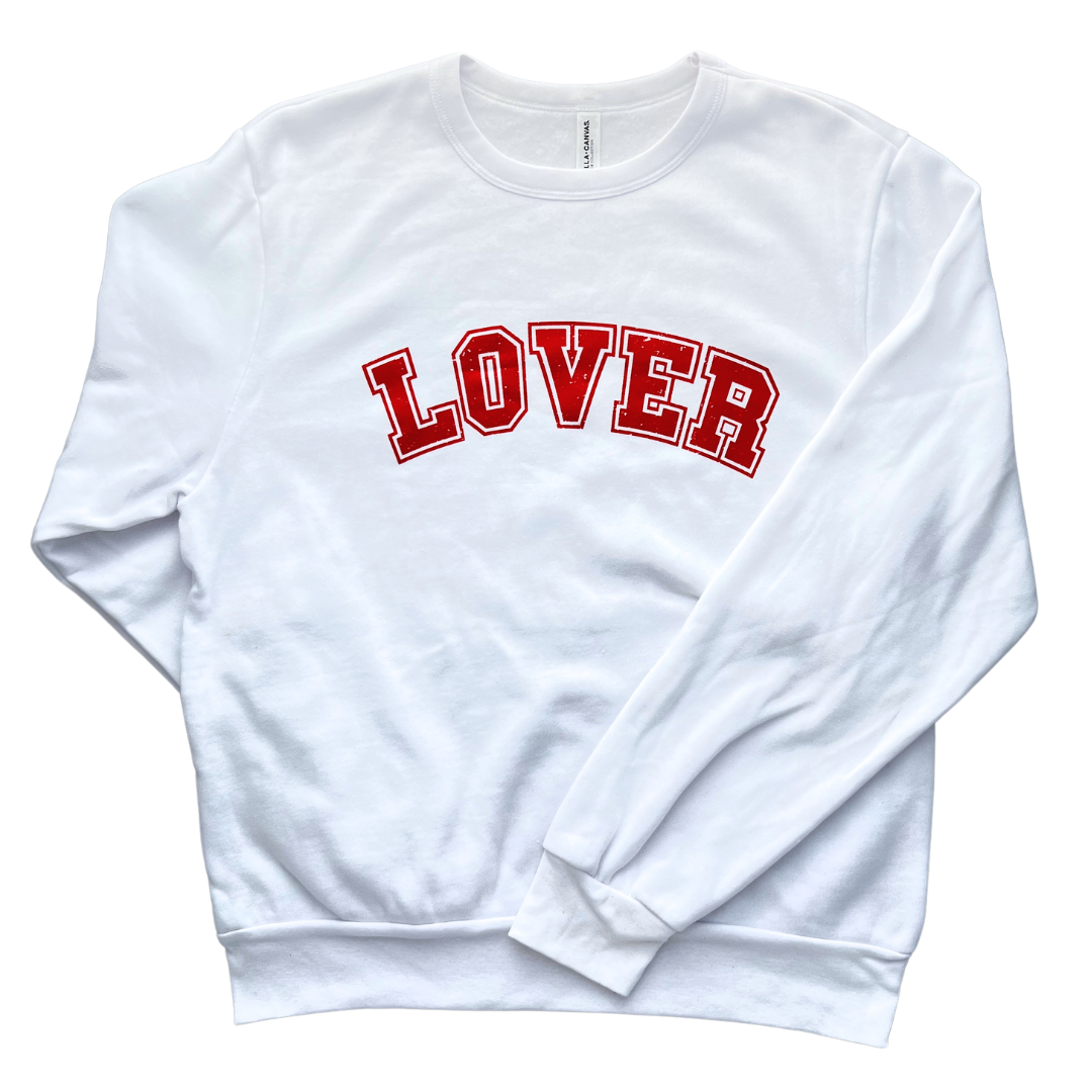 White Sweatshirt says, "LOVER" in red college font. 