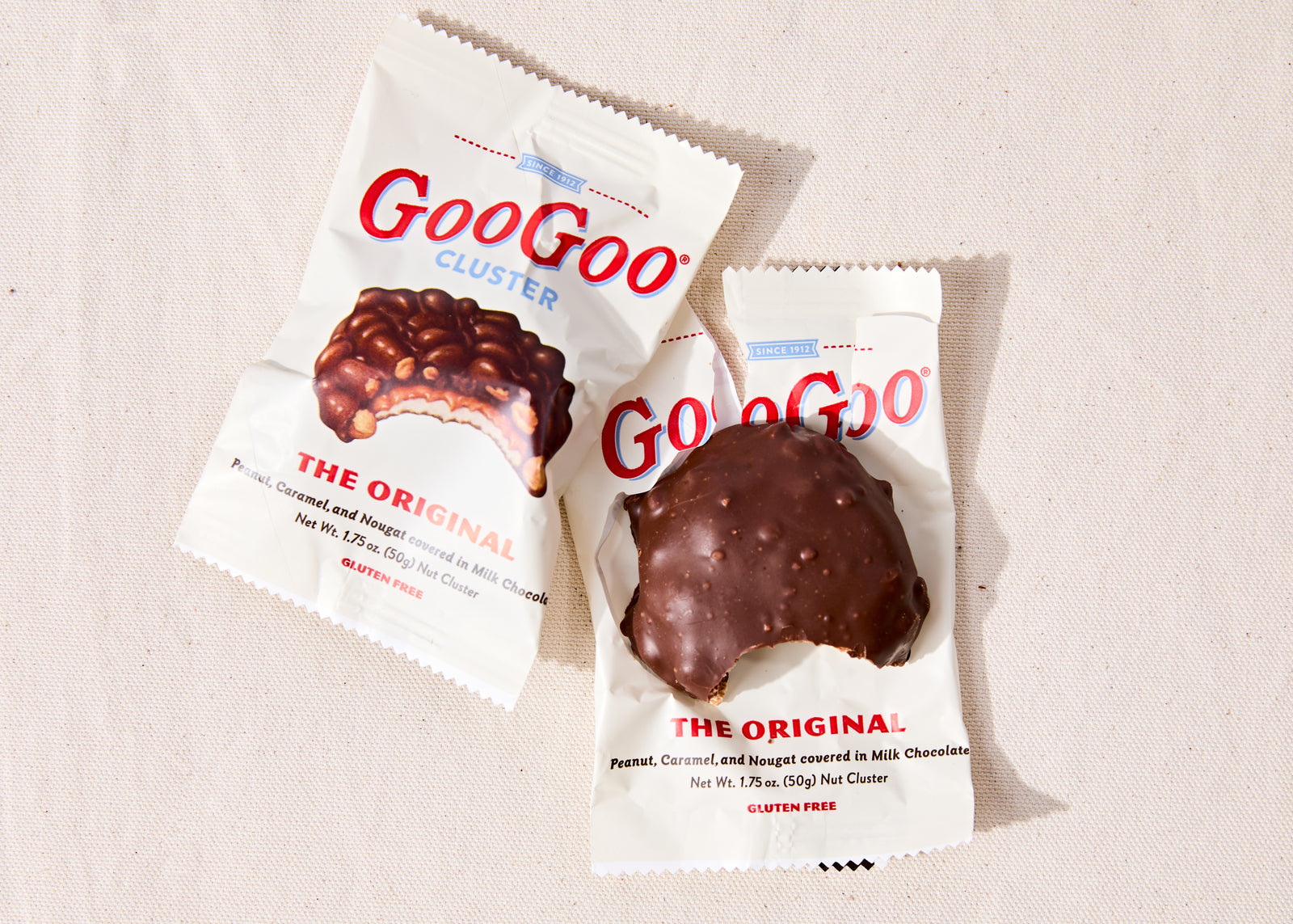 GooGoo Cluster candy bar with marshmallow nougat caramel and peanuts covered in chocolate.