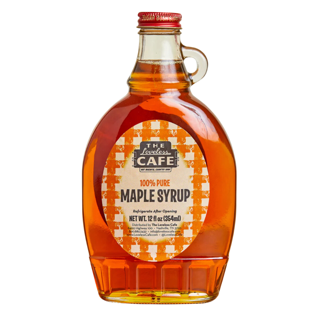 100% Pure Maple Syrup in glass bottle .