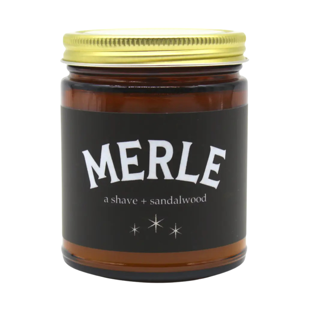 Merle Candle scented with A Shave and Sandalwood, in amber glass jar with lid.