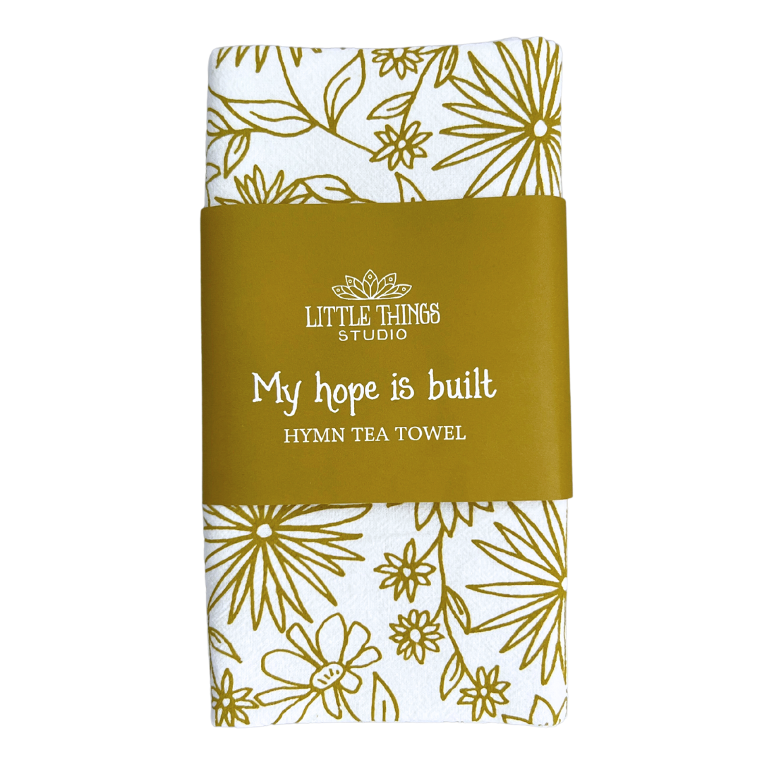 cotton kitchen towel floral design and hymn lyrics.