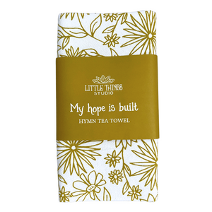 cotton kitchen towel floral design and hymn lyrics.