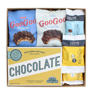 A Nashville chocolate gift box containing various artisan chocolate items, including GooGoo Cluster, Colts, and Bumble Bees, with branding and gift wrapping visible.