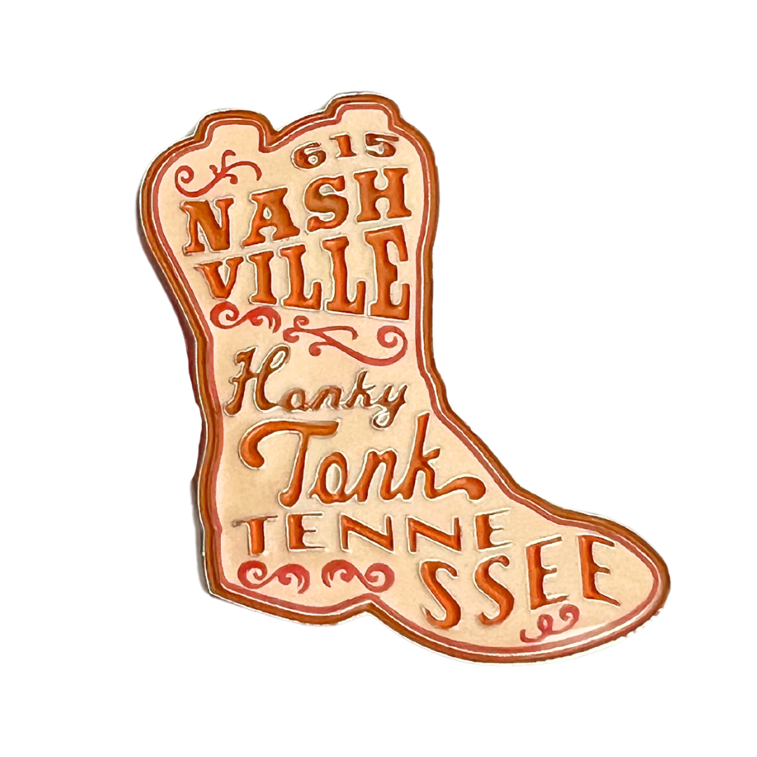 1.5 inch orange enamel boot pin.