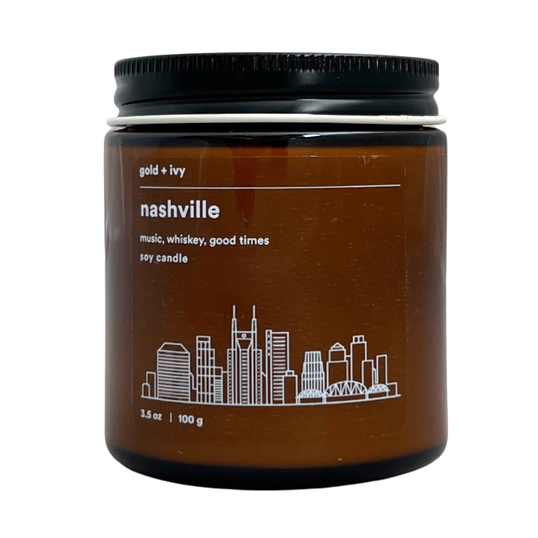 "nashville" mini candle from gold and ivy. 3.5 oz amber glass jar with lid. 