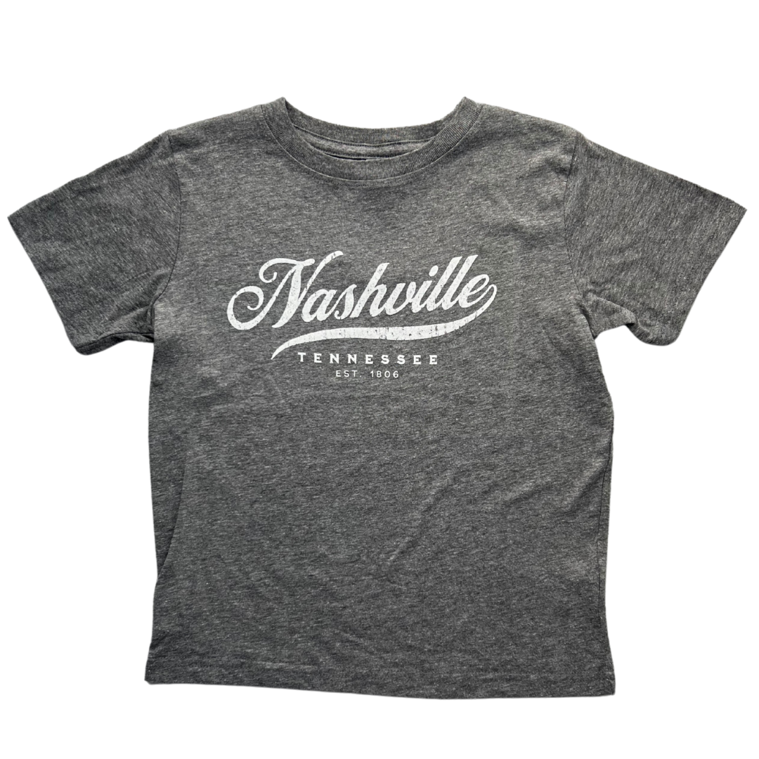 Grey toddler shirt says, "Nashville Tennessee" screen-printed in white. 