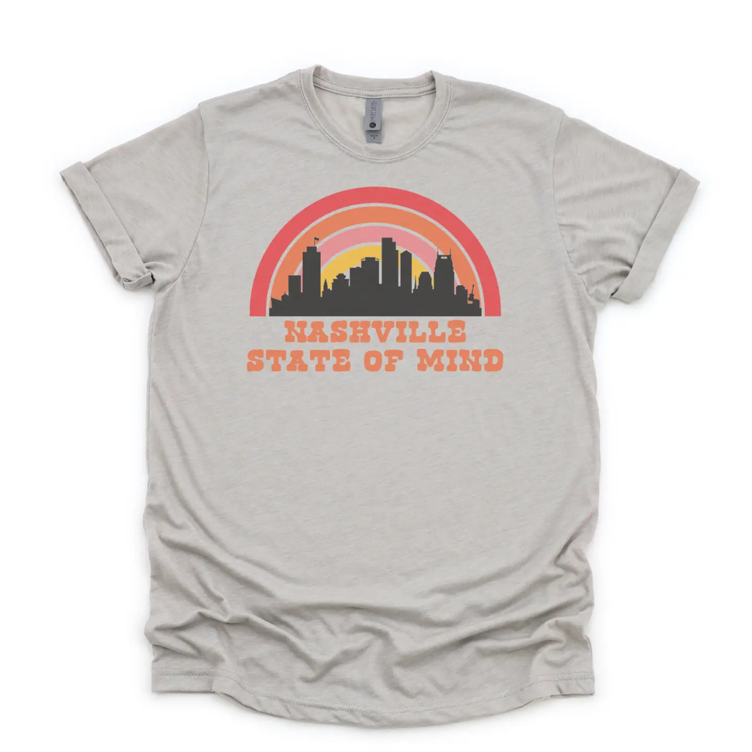 Light grey shirt says, "Nashville State of Mind" screen-printed with skyline and pink tone rainbow.  