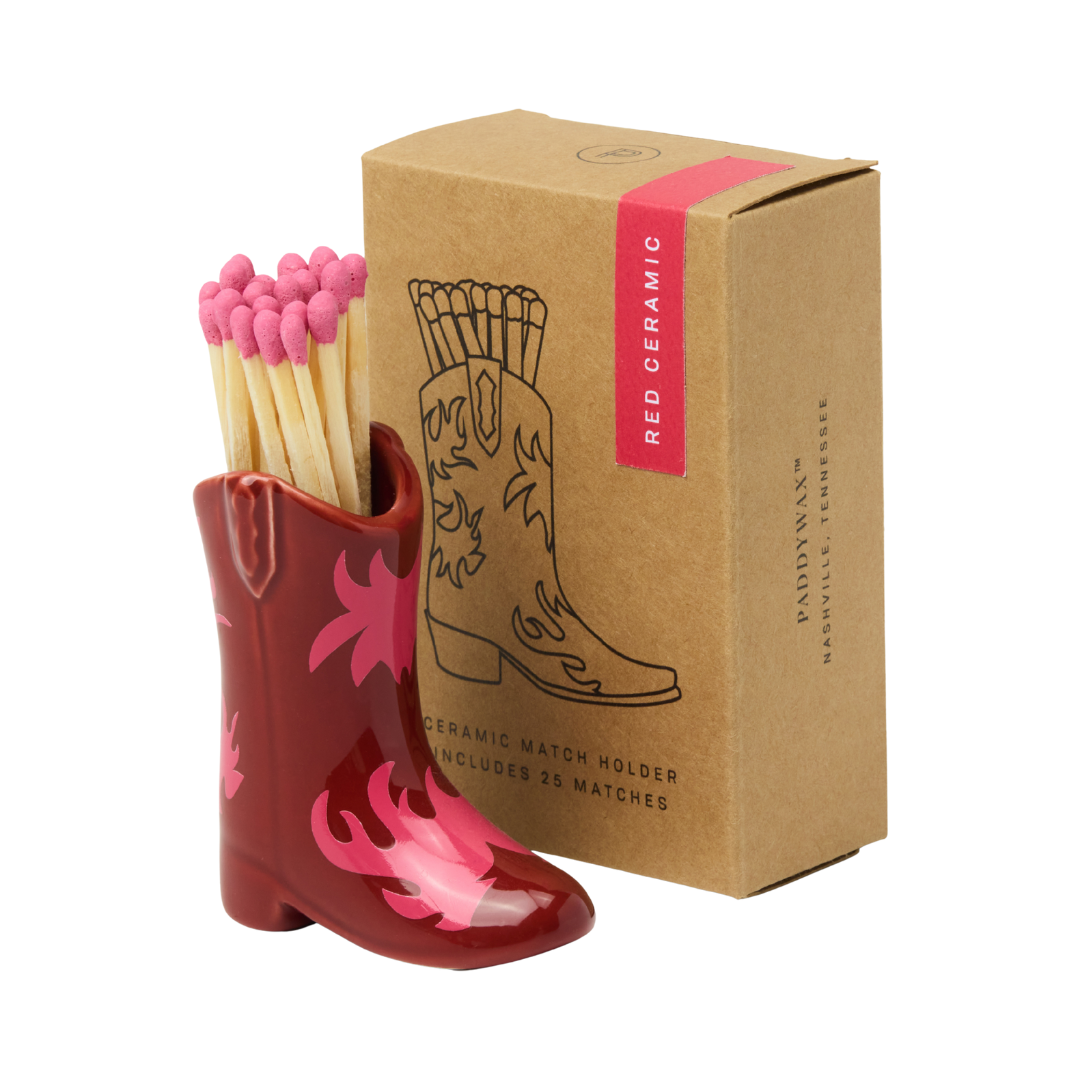 25 safety matches in white ceramic cowboy boot matchstick holder.