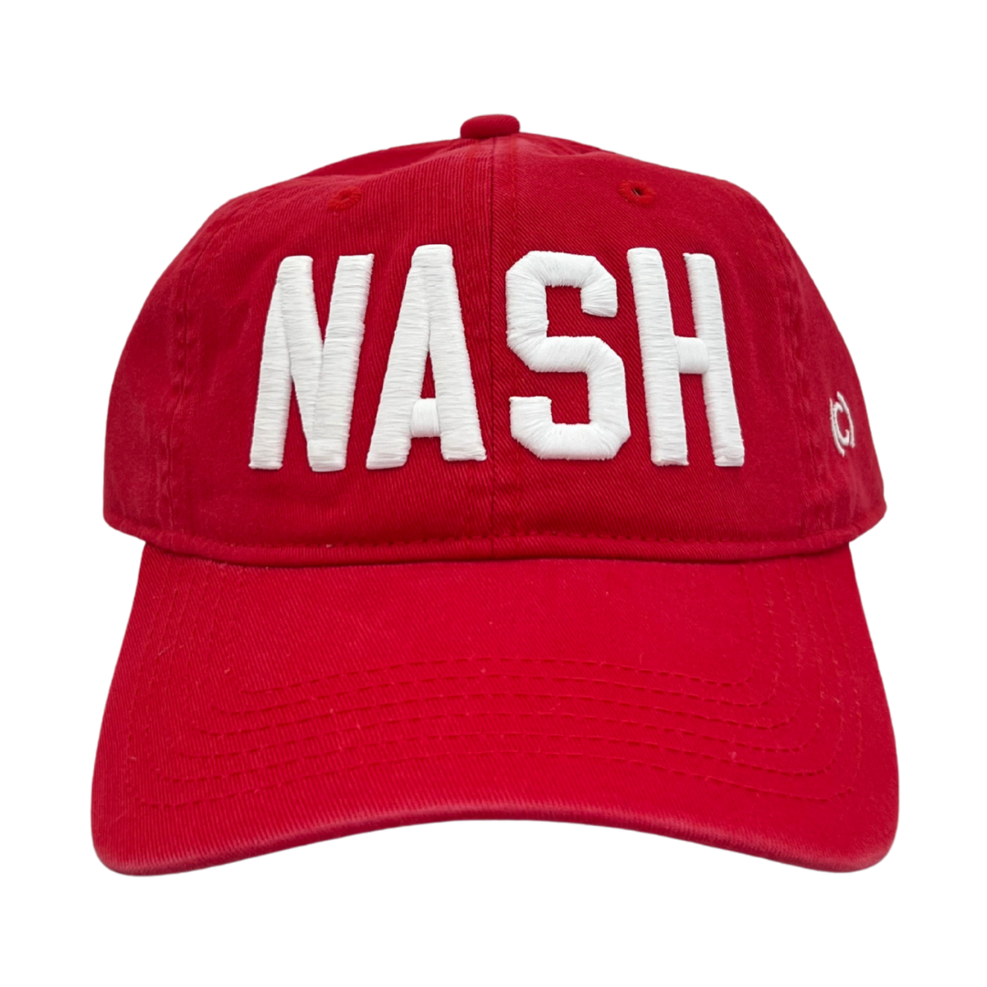 REd cotton hat with "NASH" embroidered in white. 