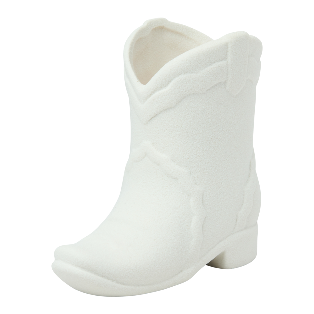 6 oz White cowgirl candle in a ceramic boot.