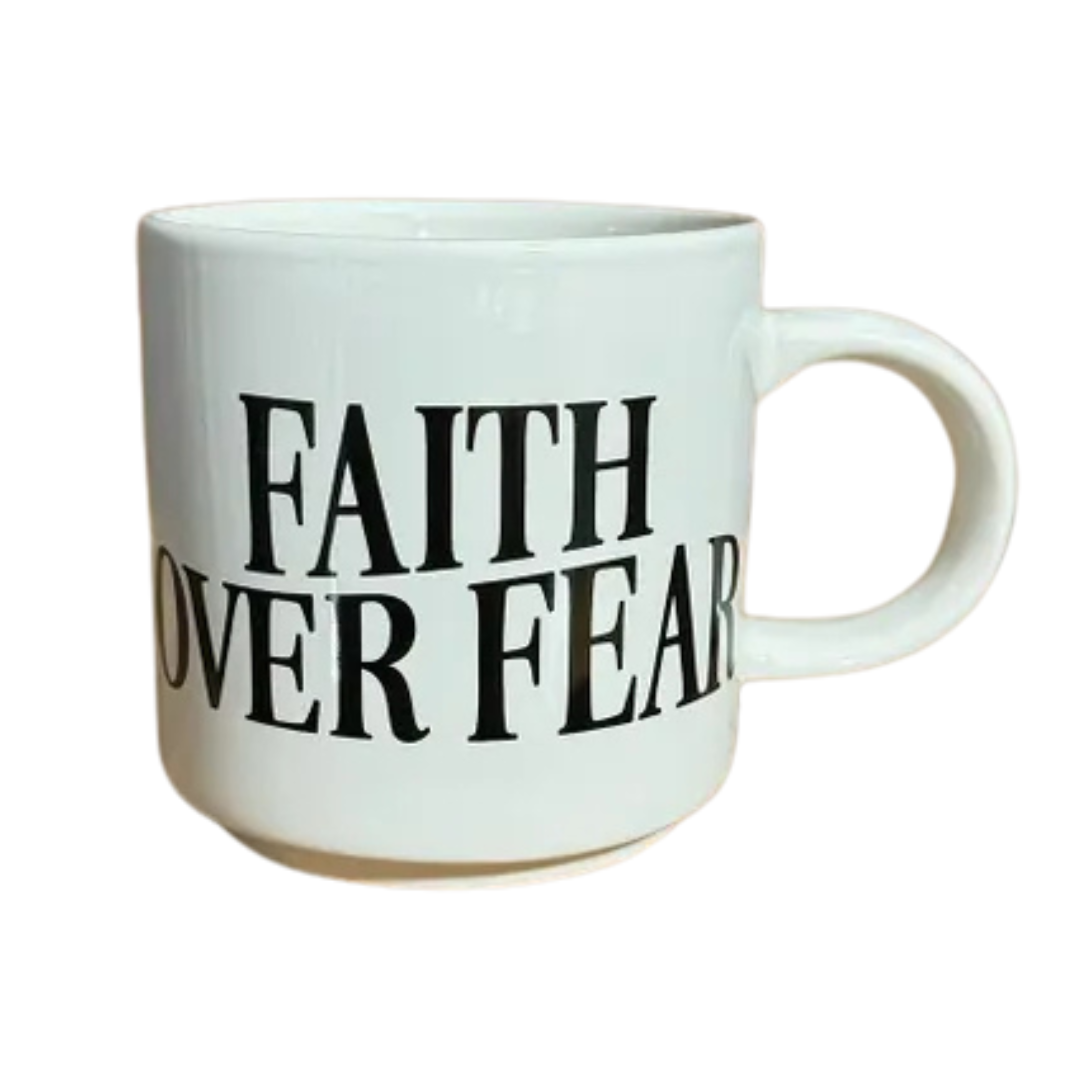 White mug that states "Faith Over Fear" in a cute font. Letters printed in black.