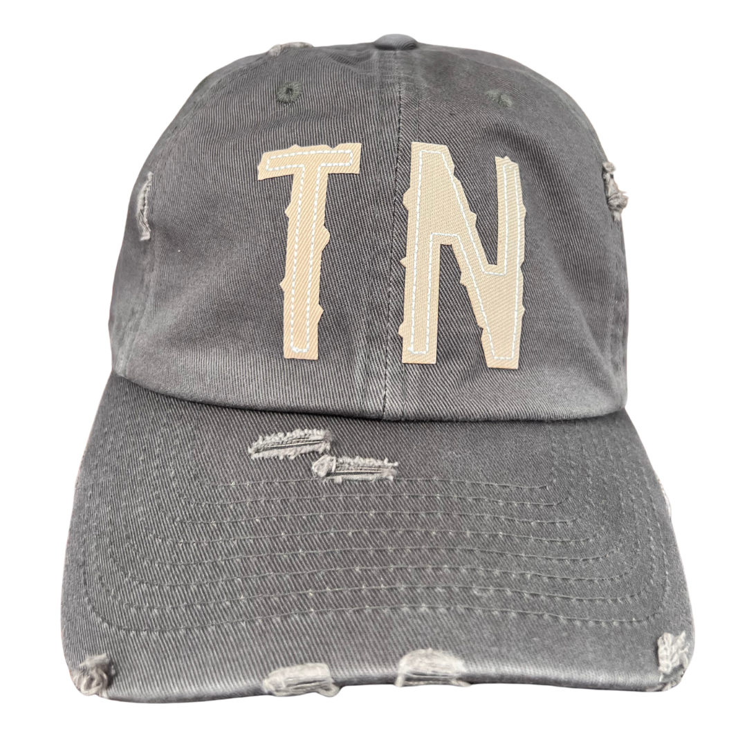 gray ball cap with TN applique. 