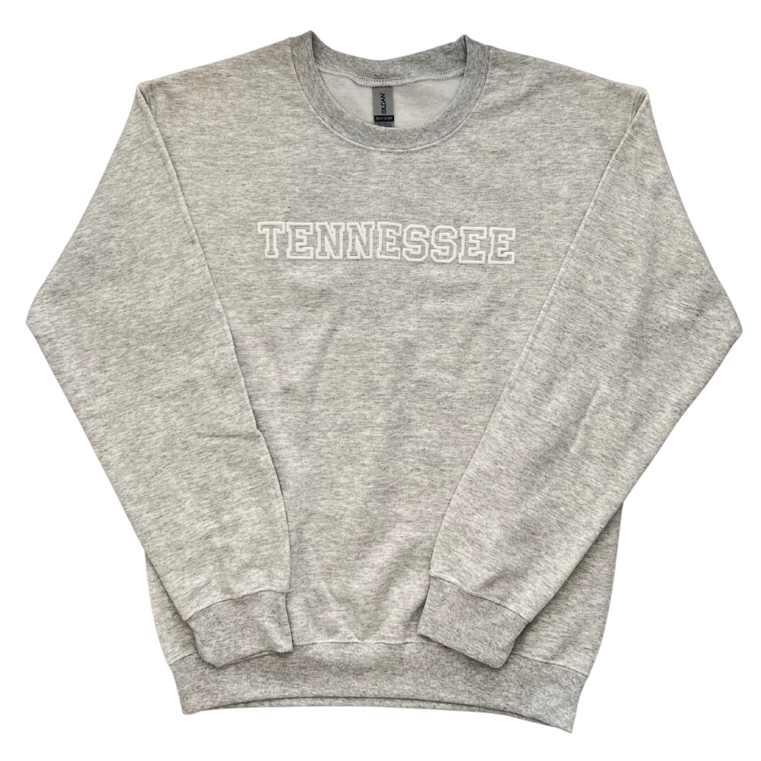 Light gray sweatshirt with "Tennessee" in puffy block lettering. 