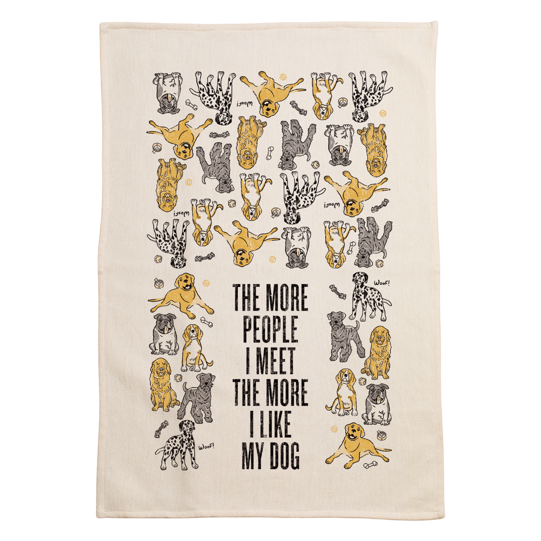 screen printed on cotton kitchen towel in black and gold, "the more people i meet the more l like my dog" 