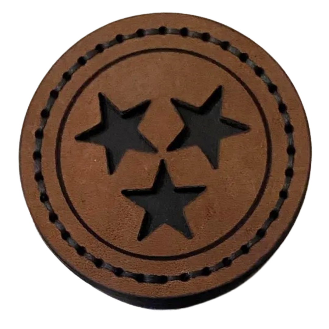approximately 3 inch round leather magnet.  