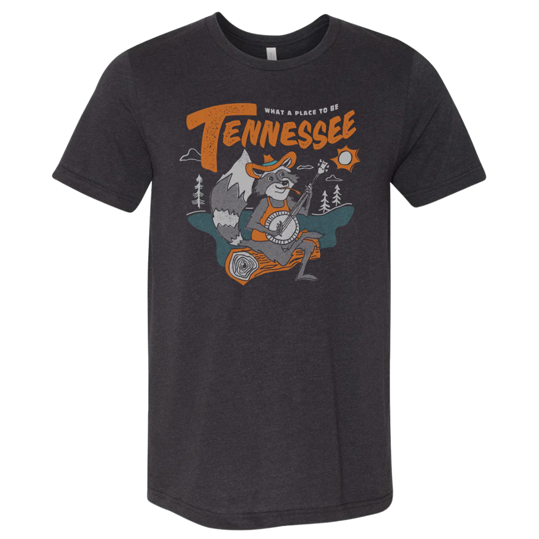 Tennessee racoon playing a banjo on dark grey shirt. 