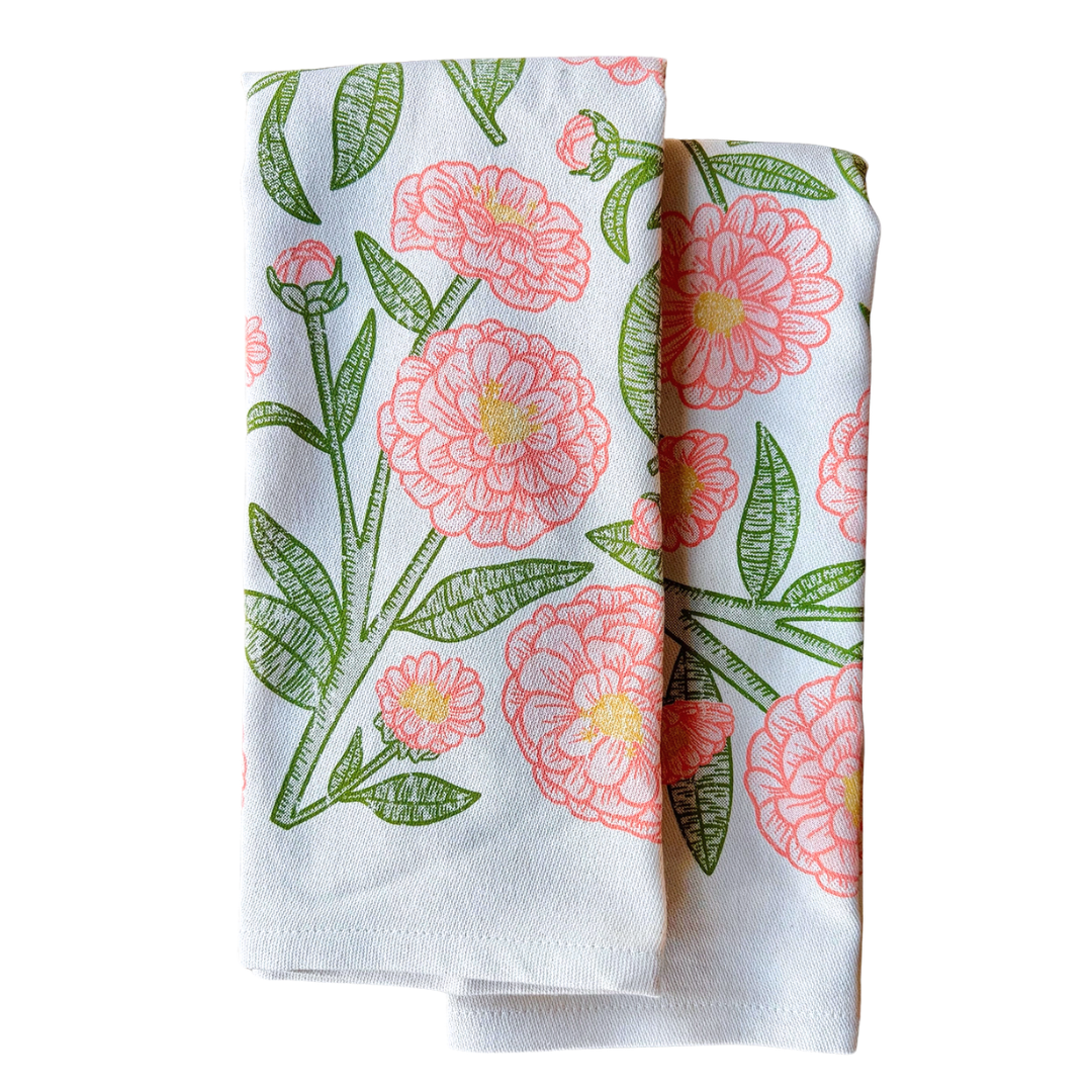Orange flowers screen printed on cotton kitchen towel. 