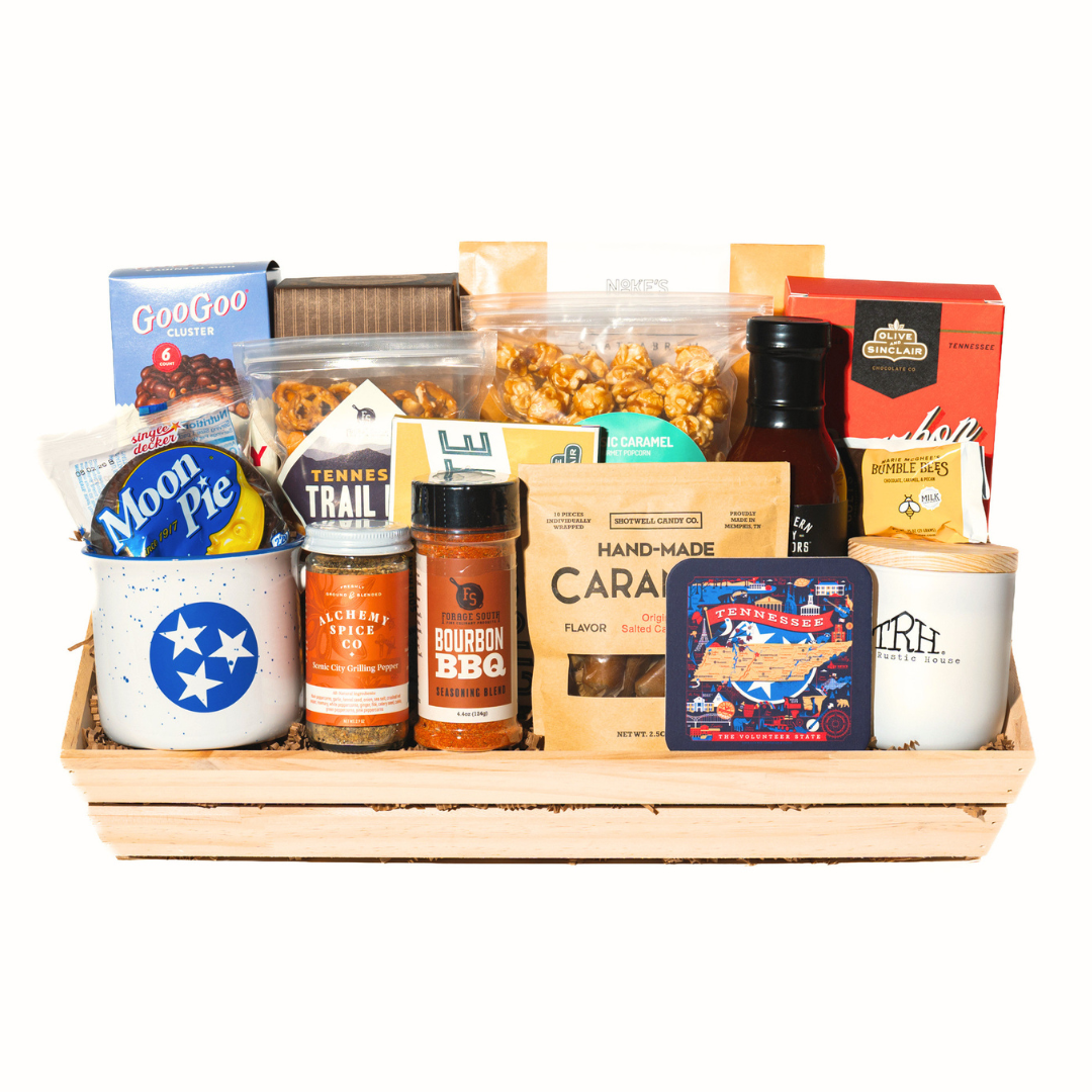 Gift basket full of tennessee snacks, seasoning, sauces, candle and mug. 