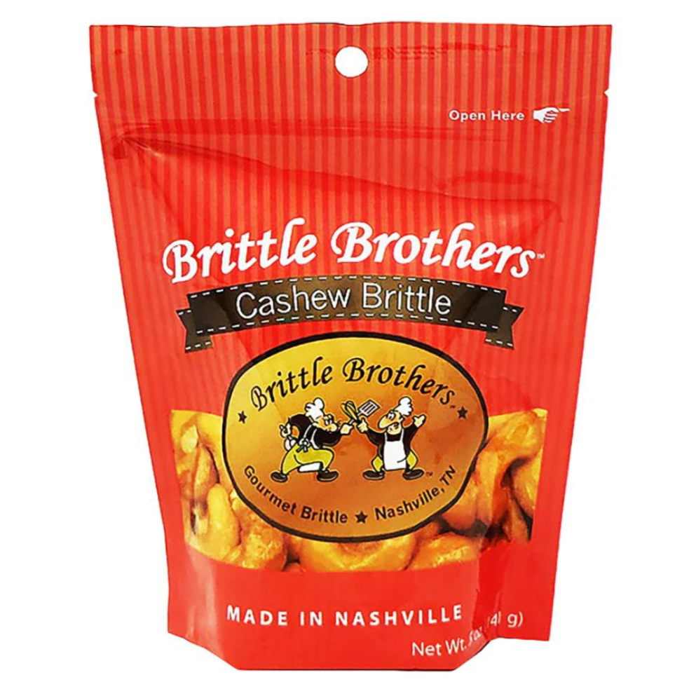 Red packaged cashew brittle from Brittle Brothers. Made in Nashville. White lettering. Has a rip and resealable package.