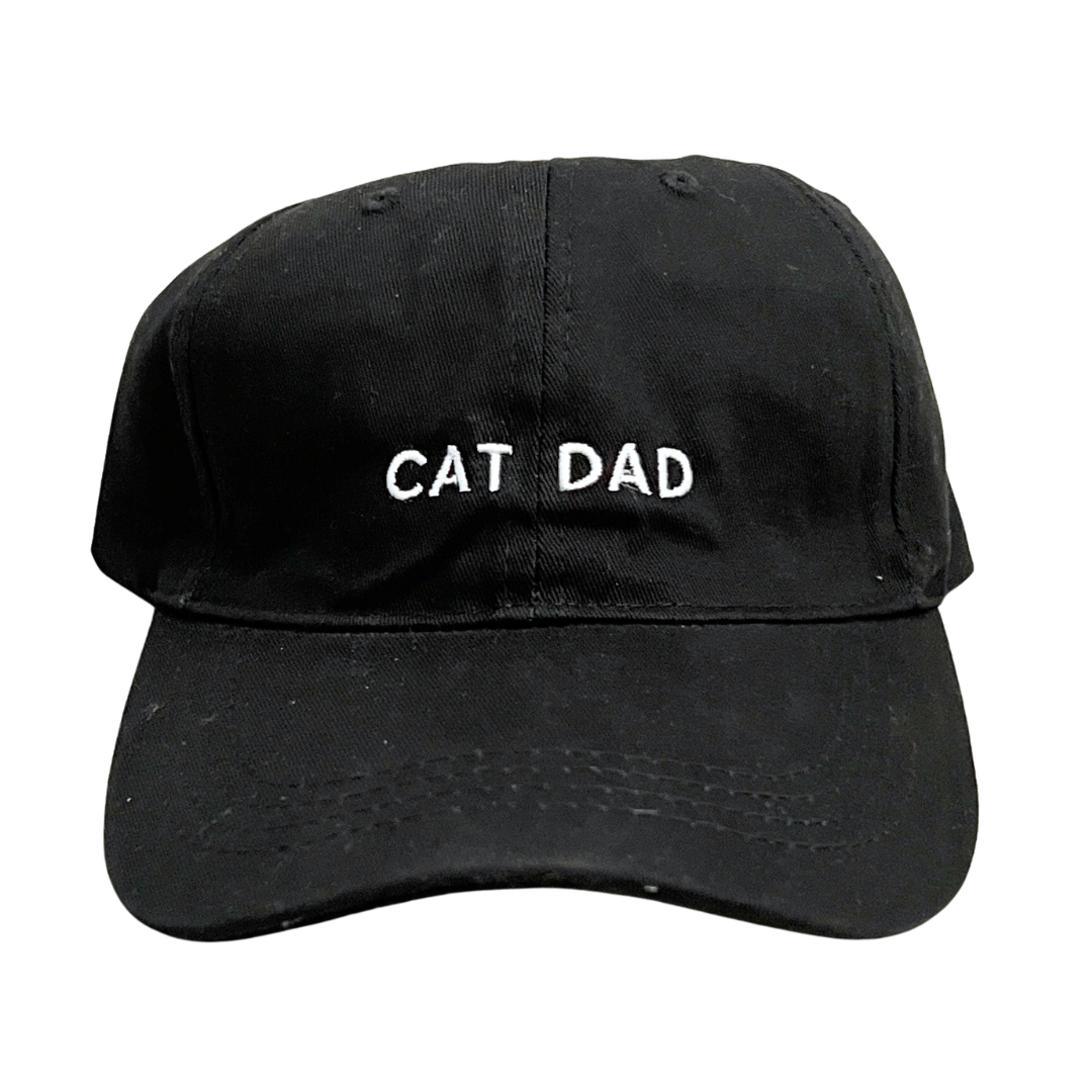 Cat Dad embroidered in white on black ball cap. 