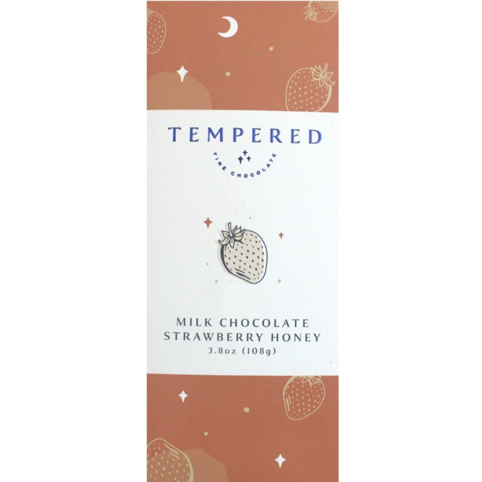 Tempered Milk Chocolate Strawberry Honey, 3.8 oz. Red packaging with logo on it. Artwork of a strawberry.