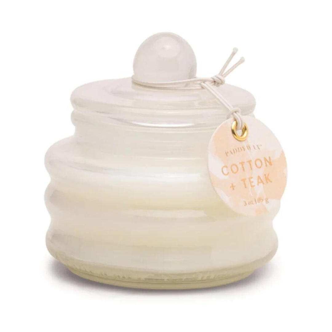 3 oz cotton + teak candle from Paddywax. Comes in a small enclosed holder. Perfect for a gift home and easy to travel with.