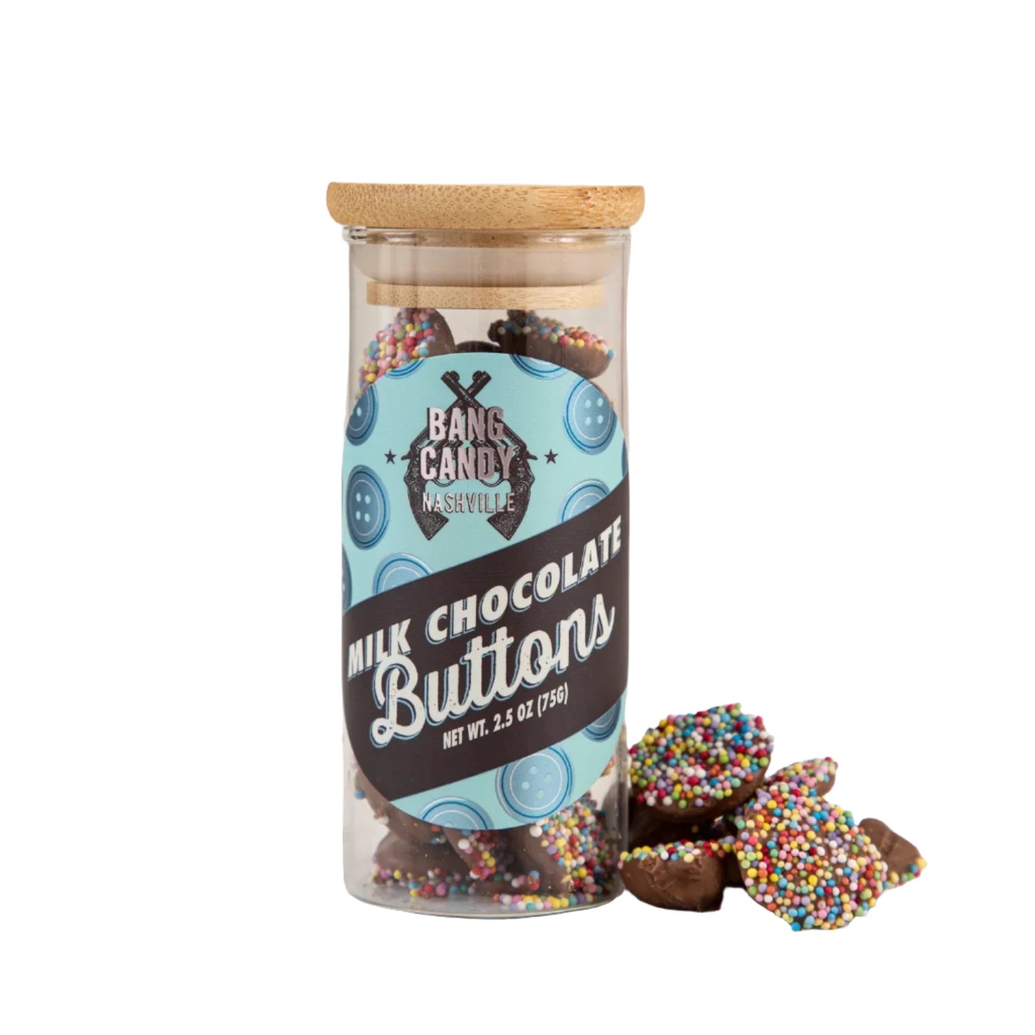 Rainbow sprinkle coated milk chocolate buttons that come in a clear sealed bottle. Has a wood-finished sealer top. 2.5 oz. Label says Bang Candy Nashville.