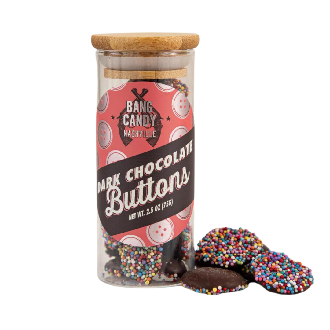 Rainbow sprinkle coated dark chocolate buttons that come in a clear sealed bottle. Has a wood-finished sealer top. 2.5 oz. Label says Bang Candy Nashville.