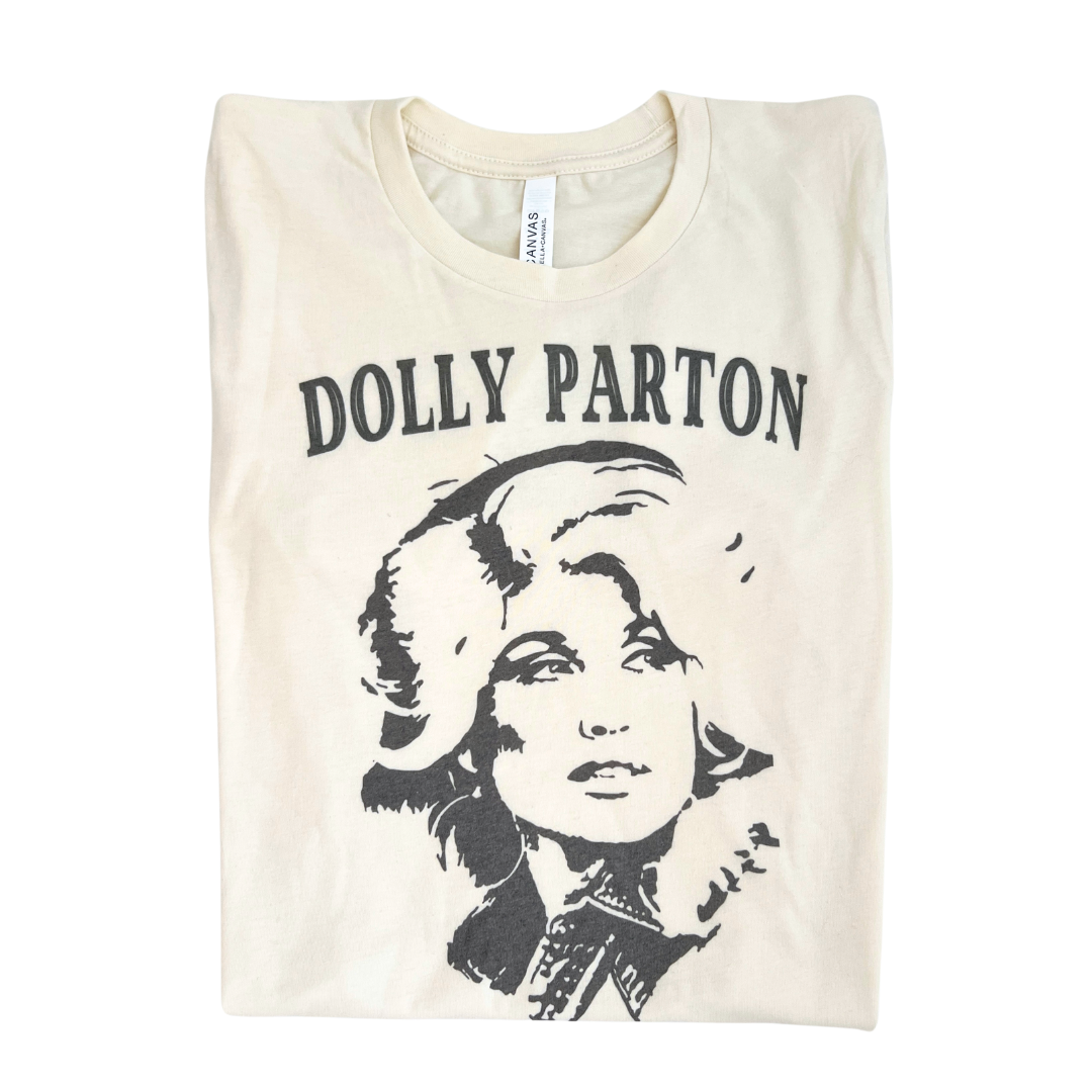 Dolly Parton shirt that will have everyone on the lookout! Soft cotton tee with the face of the country music queen herself. A shirt that will have you singing "9-5".