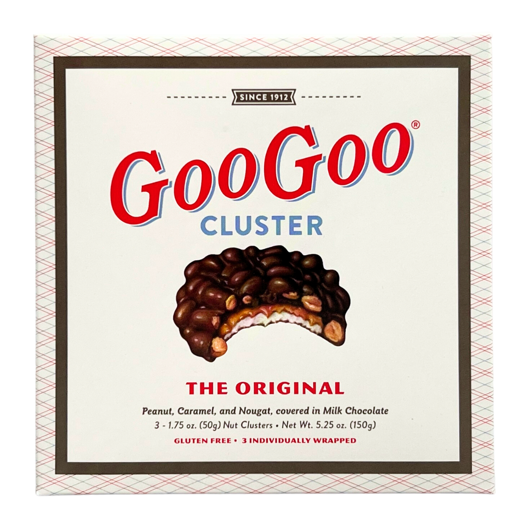  3 GooGoo Cluster candy bars with marshmallow nougat caramel and peanuts covered in chocolate.