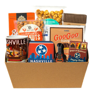 collection of snacks mug, coaster, mints and playing cards in a gift basket.